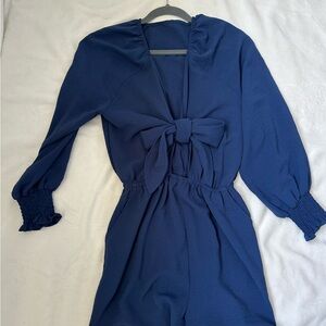 Dark blue jumpsuit, long sleeves, shorts